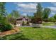 Beautiful brick home with two-car garage, landscaped yard, and circular driveway at 955 Sagamore Dr, Louisburg, NC 27549