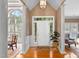 Elegant foyer featuring hardwood floors, white columns, and a beautiful chandelier at 955 Sagamore Dr, Louisburg, NC 27549