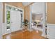 Welcoming foyer featuring wood floors and white columns leading into the living room at 955 Sagamore Dr, Louisburg, NC 27549