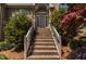 Brick stairs leading to front entrance with red-flowered trees lining the steps at 955 Sagamore Dr, Louisburg, NC 27549