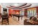 Spacious game room with a pool table, comfortable seating, and a classic elegant design at 955 Sagamore Dr, Louisburg, NC 27549