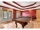 Game room boasting a pool table, elegant lighting, and French doors to the exterior at 955 Sagamore Dr, Louisburg, NC 27549