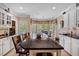 Spacious kitchen island with seating and views of breakfast nook in bright, well-appointed kitchen at 955 Sagamore Dr, Louisburg, NC 27549