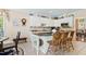 Charming kitchen featuring white cabinets, granite countertops, and an island with seating at 955 Sagamore Dr, Louisburg, NC 27549