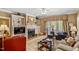 Comfortable living room with fireplace, built-in shelves, and large windows at 955 Sagamore Dr, Louisburg, NC 27549