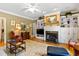 Comfortable living room with fireplace, built-in shelves, and lots of seating at 955 Sagamore Dr, Louisburg, NC 27549