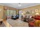 Spacious living room featuring a fireplace, large windows, and hardwood floors at 955 Sagamore Dr, Louisburg, NC 27549