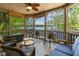 Relax on this comfortable screened in porch, complete with overhead fan and lake views at 955 Sagamore Dr, Louisburg, NC 27549