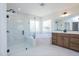 Modern bathroom with a luxurious soaking tub, walk-in shower, and double vanity with sleek fixtures at 0006 Tallulah Loop Lane, Cedar Grove, NC 27231
