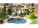 Aerial view of the home featuring a backyard with a pool, deck, gazebo and landscaped yard at 10001 Sandcreek Ct, Chapel Hill, NC 27517