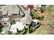 Aerial view of the backyard featuring a deck, hot tub, and mature trees at 10001 Sandcreek Ct, Chapel Hill, NC 27517