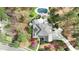 Overhead aerial view of the property showcasing the home, backyard pool, and surrounding trees at 10001 Sandcreek Ct, Chapel Hill, NC 27517