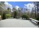 Large deck overlooking a beautifully landscaped backyard with an in-ground pool at 10001 Sandcreek Ct, Chapel Hill, NC 27517