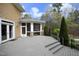 Backyard boasts a spacious deck, screened-in porch, and mature trees at 10001 Sandcreek Ct, Chapel Hill, NC 27517