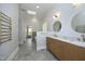 Bathroom featuring double sinks, vanity, and luxurious soaking tub at 10001 Sandcreek Ct, Chapel Hill, NC 27517