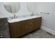 Modern bathroom vanity with double sinks, stylish fixtures, and marble countertop at 10001 Sandcreek Ct, Chapel Hill, NC 27517