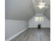 Bedroom with gray vinyl flooring and neutral paint at 10001 Sandcreek Ct, Chapel Hill, NC 27517