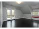 Bedroom with dark wood floors, a balcony, a window seat and neutral paint at 10001 Sandcreek Ct, Chapel Hill, NC 27517