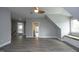Bedroom with gray vinyl flooring, neutral paint, and a window seat at 10001 Sandcreek Ct, Chapel Hill, NC 27517