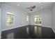 Spacious bedroom with hardwood floors, a ceiling fan, and access to the outdoor patio at 10001 Sandcreek Ct, Chapel Hill, NC 27517