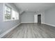 Bedroom with gray vinyl flooring and neutral paint at 10001 Sandcreek Ct, Chapel Hill, NC 27517