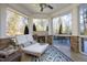 Inviting covered patio featuring a fireplace and comfortable seating area at 10001 Sandcreek Ct, Chapel Hill, NC 27517