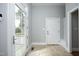 Charming foyer with access to the deck, mudroom, and front door at 10001 Sandcreek Ct, Chapel Hill, NC 27517