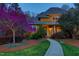 Charming two-story home with a walkway leading to the front door, enhanced by a vibrant tree at 10001 Sandcreek Ct, Chapel Hill, NC 27517