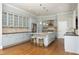 Stylish kitchen with an island, granite countertops, stainless appliances, and custom cabinetry at 10001 Sandcreek Ct, Chapel Hill, NC 27517
