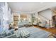 Inviting living room boasts hardwood floors, a large rug, and a view to the kitchen offering comfortable seating options at 10001 Sandcreek Ct, Chapel Hill, NC 27517