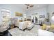 Spacious main bedroom with a ceiling fan, lots of natural light and neutral decor at 10001 Sandcreek Ct, Chapel Hill, NC 27517