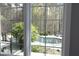 Scenic pool view from a window highlighting the outdoor leisure space at 10001 Sandcreek Ct, Chapel Hill, NC 27517