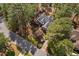 Overhead view of an elegant home with a beautiful landscaped yard nestled among mature trees in a serene neighborhood at 101 Preston Arbor Ln, Cary, NC 27513