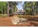 Back of a brick home with multiple decks surrounded by mature trees and natural areas at 101 Preston Arbor Ln, Cary, NC 27513