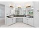 Elegant bathroom featuring double vanity sinks, granite countertops, and ample cabinet space at 101 Preston Arbor Ln, Cary, NC 27513