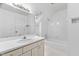 Clean bathroom with skylight, vanity, and tiled shower over tub at 101 Preston Arbor Ln, Cary, NC 27513