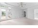 Bright bedroom with access to the porch, featuring a ceiling fan and an en suite bathroom at 101 Preston Arbor Ln, Cary, NC 27513