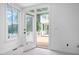 Cozy bedroom with natural lighting, a view of the deck, and access to the backyard at 101 Preston Arbor Ln, Cary, NC 27513