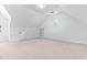 Large bonus room featuring a round window and built-in shelves at 101 Preston Arbor Ln, Cary, NC 27513