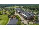 Stunning aerial view of the clubhouse surrounded by lush landscaping and well-manicured grounds at 101 Preston Arbor Ln, Cary, NC 27513