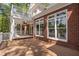 Brick home featuring a spacious covered deck, ideal for outdoor entertaining and relaxation at 101 Preston Arbor Ln, Cary, NC 27513
