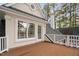 A home's outdoor wooden deck offers a relaxing place to enjoy fresh air and the natural surroundings at 101 Preston Arbor Ln, Cary, NC 27513