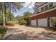 Brick home featuring a long driveway leading to a two-car garage at 101 Preston Arbor Ln, Cary, NC 27513
