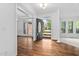 Elegant foyer with hardwood floors, an open doorway, and plenty of natural light at 101 Preston Arbor Ln, Cary, NC 27513