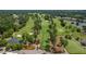 Scenic aerial view of the golf course with mature trees and lush landscaping in this community at 101 Preston Arbor Ln, Cary, NC 27513