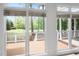 The Sunroom and Golf Course can be viewed through large windows with blinds at 101 Preston Arbor Ln, Cary, NC 27513