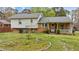 A cozy porch and a well-kept yard provide a peaceful outdoor space at 101 W Thorndale Dr, Oxford, NC 27565