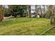 Large backyard features mature trees and landscaping, offering a private outdoor space at 101 W Thorndale Dr, Oxford, NC 27565