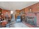Living room with brick fireplace, built-in shelves, and stairway at 101 W Thorndale Dr, Oxford, NC 27565