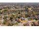 An aerial shot displays a residential area with diverse houses surrounded by lush greenery at 102 Kamprath Pl, Cary, NC 27519